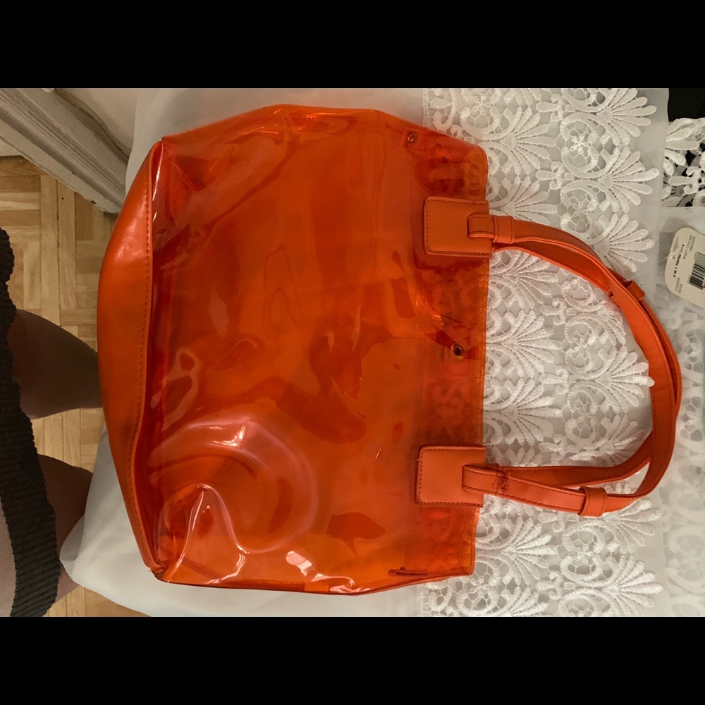 Orange clear small bag .